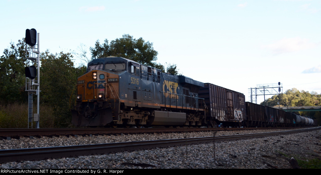CSX train L214 heads west past the signal controlling movement eastbound from #1 track to the "Switching Lead".